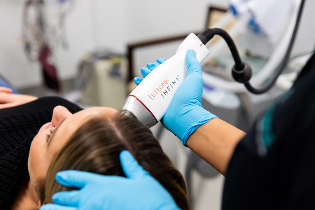 client receiving RF microneedling treatment with Lutronic INFINI on cheek at Catara Med Spa in Algonquin IL for skin rejuvenation