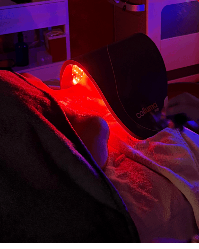 Client receiving red light therapy with Celluma Pro device at Catara Med Spa in Algonquin, IL. LED facial for collagen and skin repair.