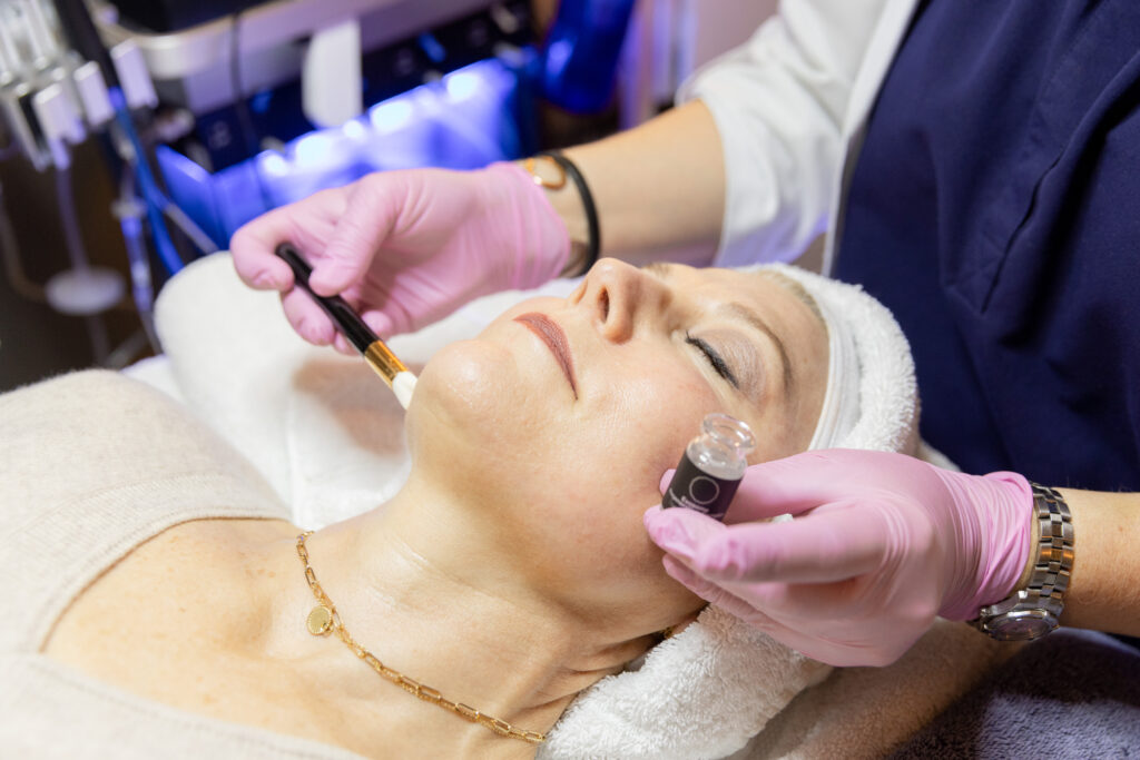 Client receiving a customized facial treatment at Catara Med Spa in Algonquin, IL during a relaxing skincare session.