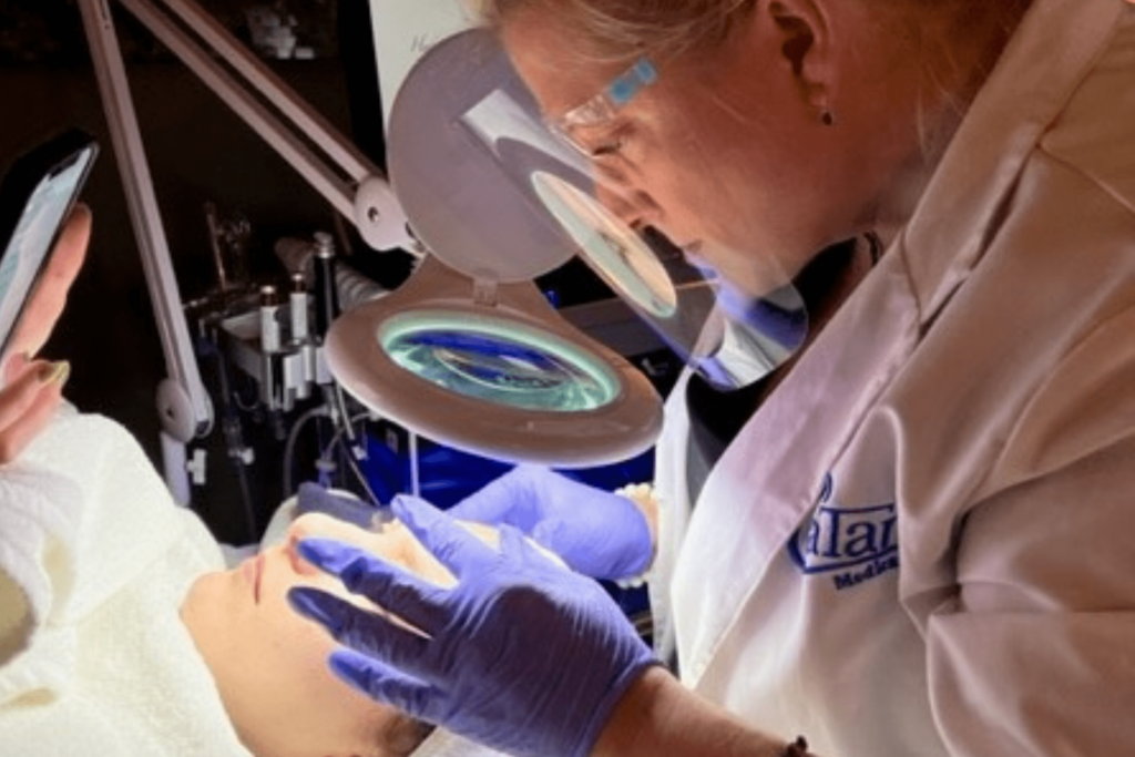 Licensed aesthetician performing acne treatment at Catara Med Spa in Algonquin, IL using precision skincare tools.
