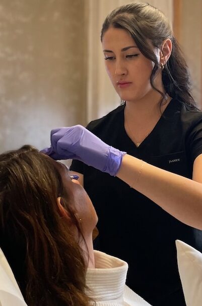 Licensed aesthetic provider at Catara Med Spa in Algonquin, IL performing a facial procedure. Precision skin care in a professional spa setting.