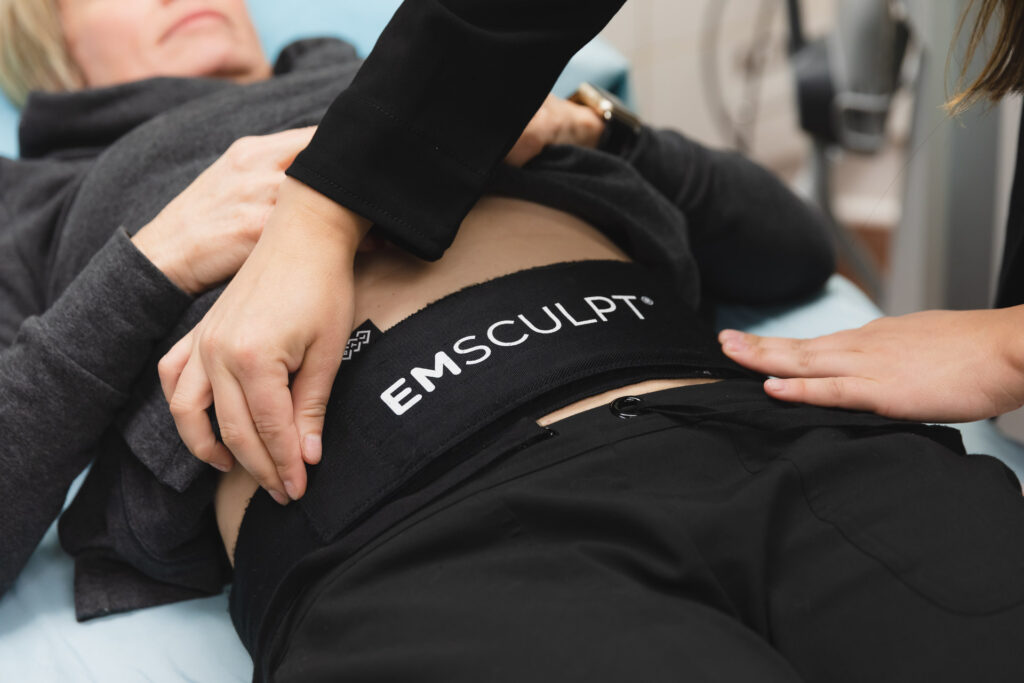 Emsculpt Neo device in use for non-invasive body sculpting, fat reduction, and muscle toning treatment.