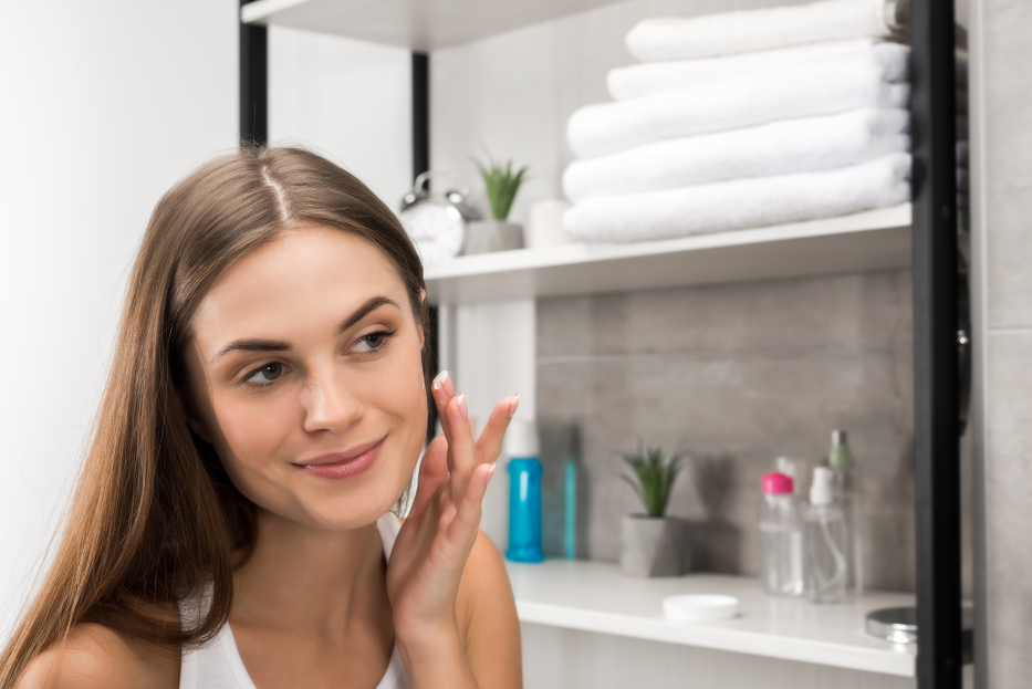Woman washing her face with gentle cleanser Skin Care Step-by-Step at Catara Medical Spa in Algonquin, IL. Step one in a radiant skin care routine.