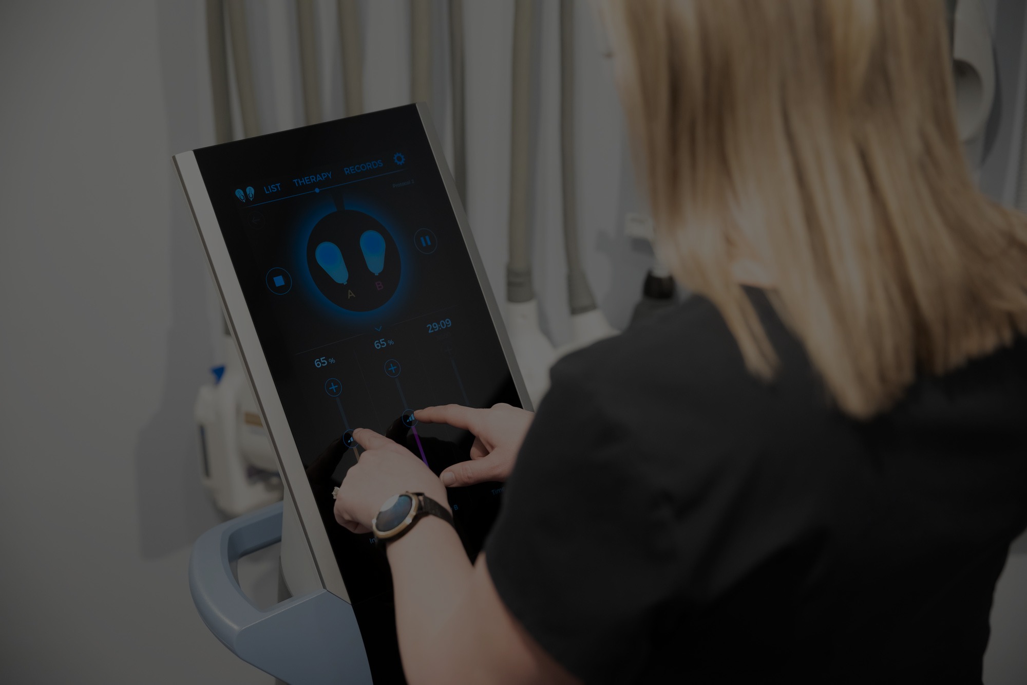 Technician adjusting Emsculpt Neo device settings at Catara Med Spa in Algonquin, IL — body contouring and muscle recovery treatment.