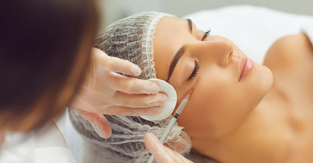 Client receiving Xeomin injection near eye area at Catara Med Spa for wrinkle reduction and rejuvenation.