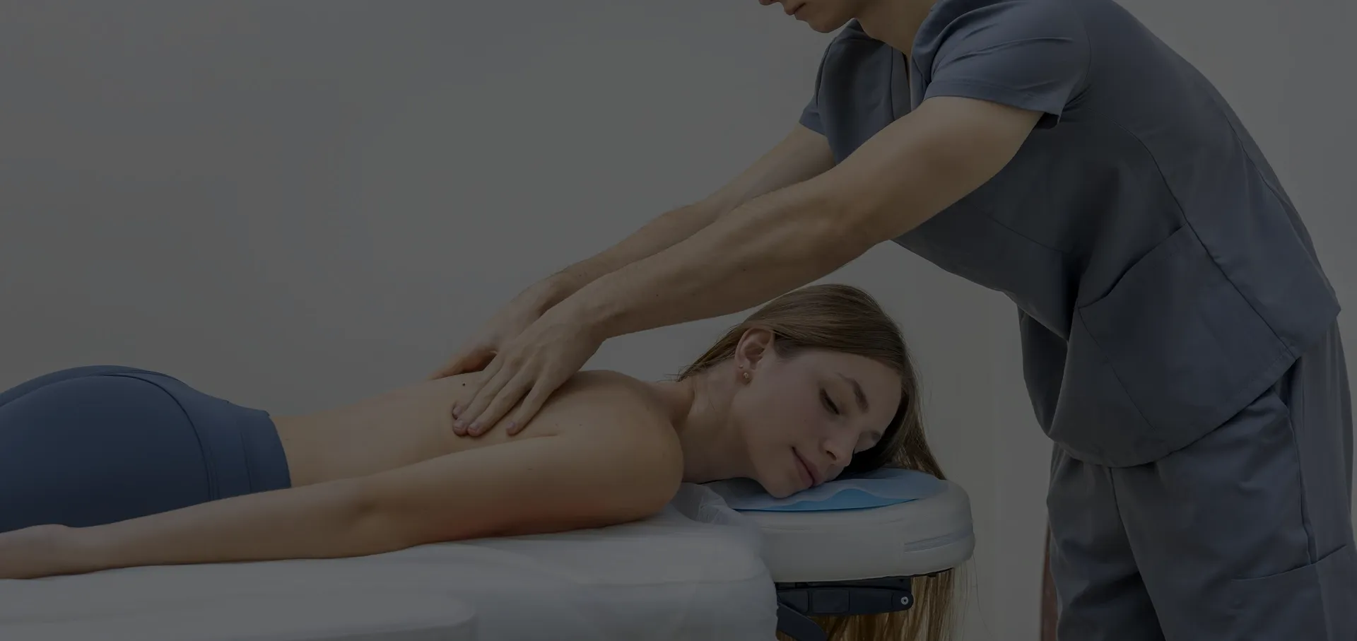 Massage therapist providing back and shoulder bodywork near Algonquin, IL.